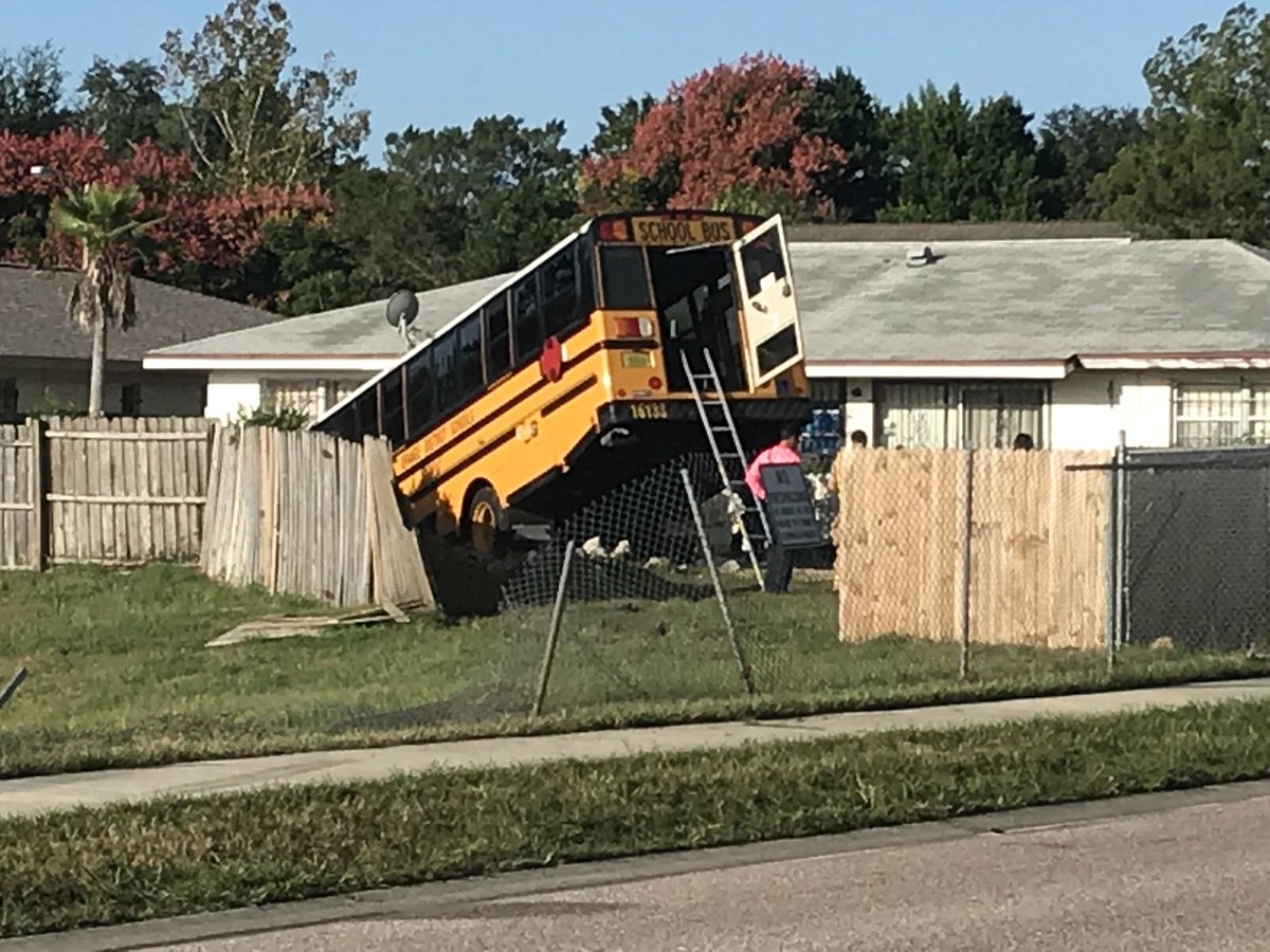 Troopers believe driver of SUV may have swerved to avoid dead cat in the road and went into bus lanebus then tried to avoid crash, struck SUV and went through the fence