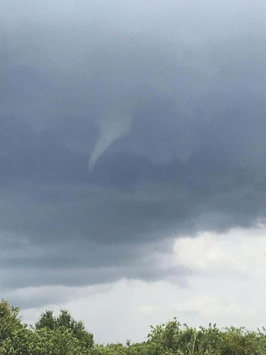 .@NWSTampaBay sent out these photos of a possible waterspout or funnel cloud over the south part of the bay this afternoon. Meteorologists say it's a common occurrence during the summer.