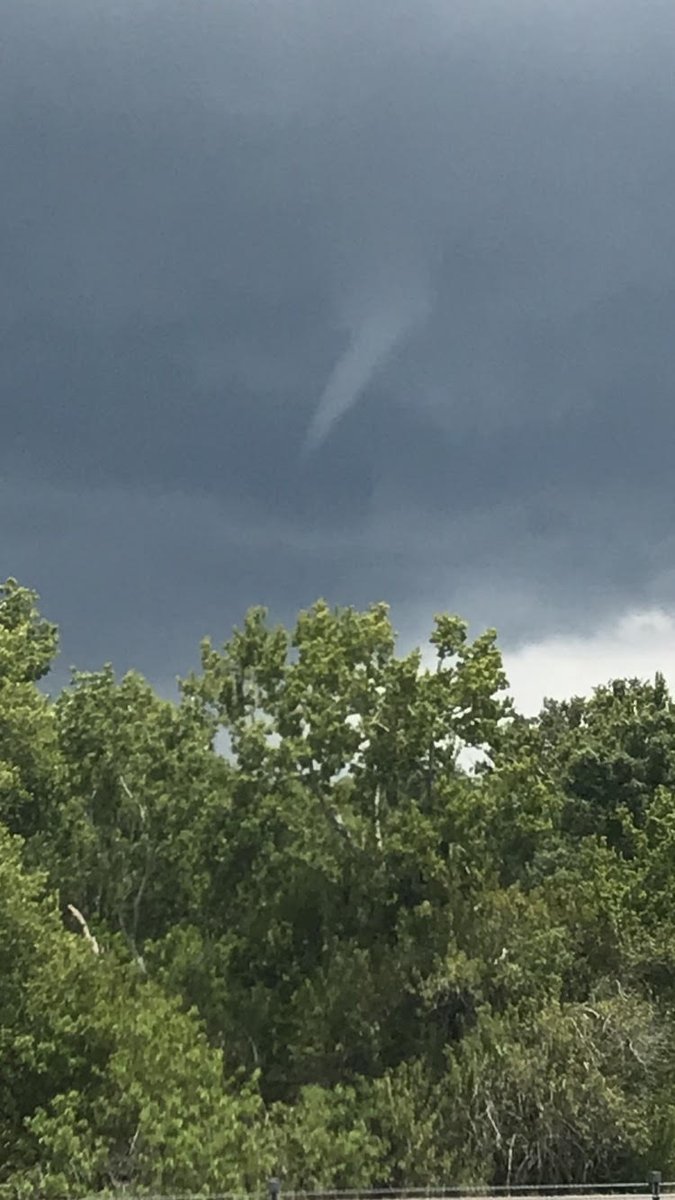 .@NWSTampaBay sent out these photos of a possible waterspout or funnel cloud over the south part of the bay this afternoon. Meteorologists say it's a common occurrence during the summer.