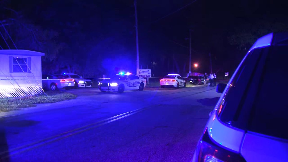 Two men were found dead and a woman was hospitalized after gunshots were heard at a Tampa mobile home park.