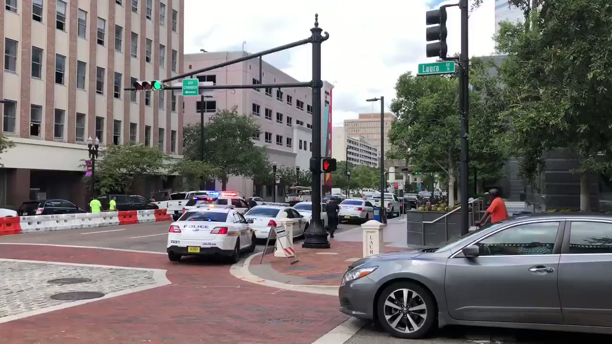 Several police cars outside the Bank of America building in downtown Jacksonville.   