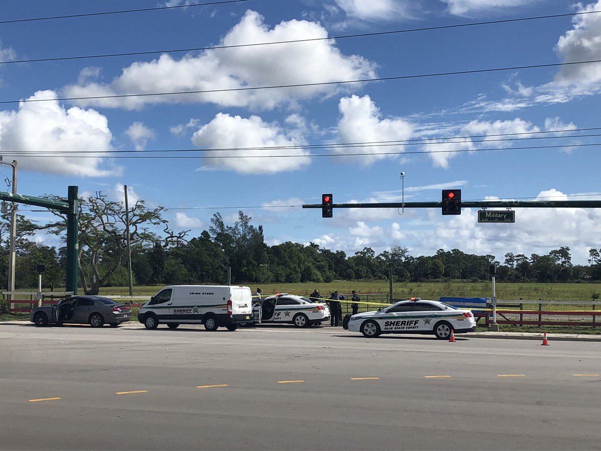 Crime scene investigators spend most of morning at scene of suspicious death in open field along Military Trail in unincorporated Boynton Beach