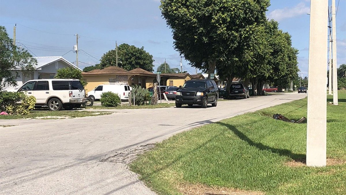 Authorities say a 15-month-old is dead after a vehicle backed over him while he was playing in a driveway in Pahokee.