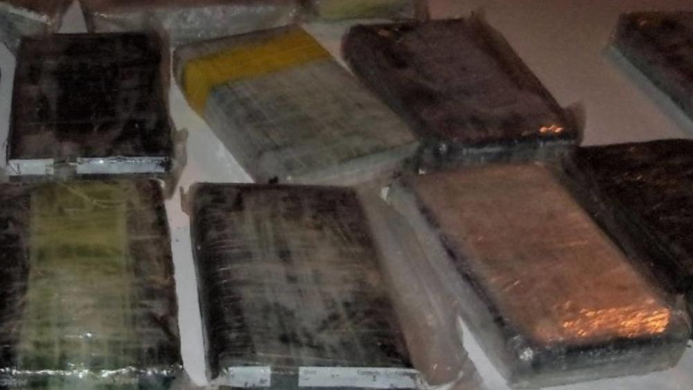 One of the kilo-sized bricks was opened and a block of white substance was exposed, according to the report. The substance field-tested positive for cocaine, deputies said.