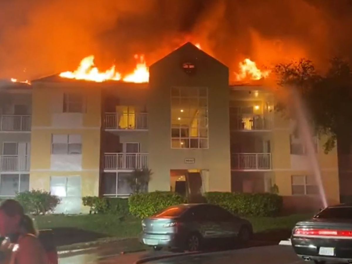 Two dozen units at a Miami-Dade condominium building were evacuated and multiple families displaced in a fire that broke out on the roof Wednesday 