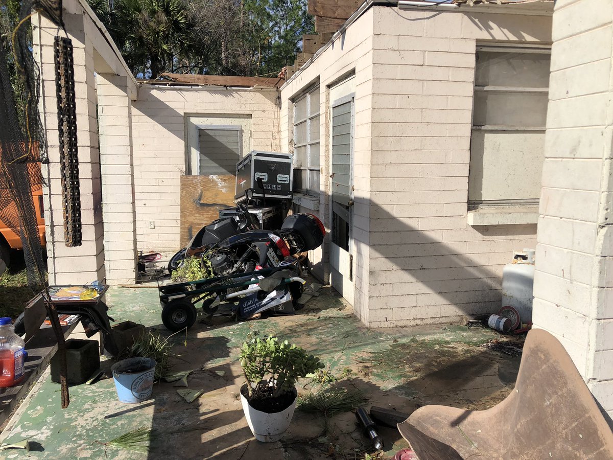 A look at some of the storm damage on Trojan Avenue off of US-1 in FlaglerCounty. Trees completed ripped out of the ground. and that is a scooter crushed underneath