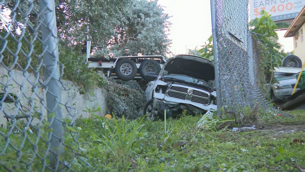 A pickup truck that was towing a boat somehow fell off the side of I-95 in Miami.