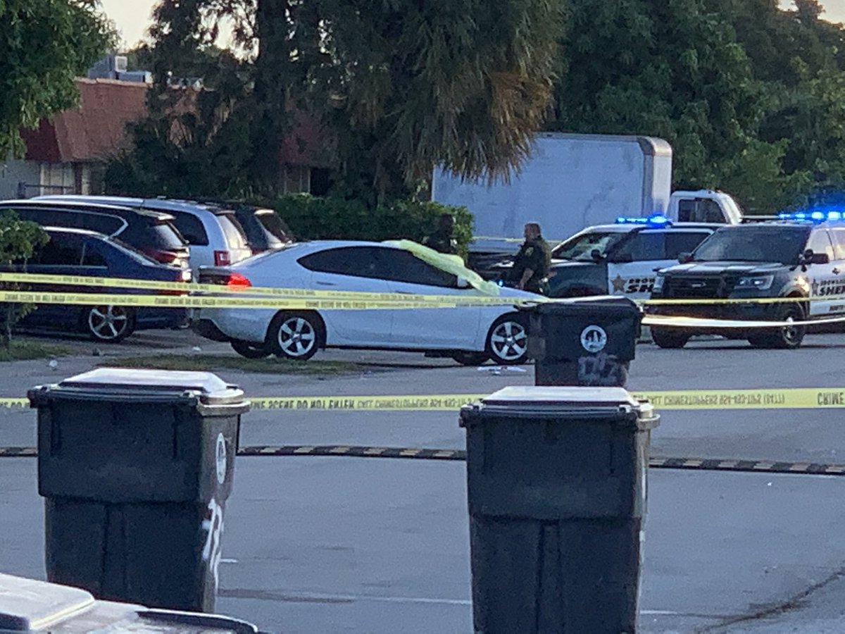 Sheriff investigating possible shooting scene in North Lauderdale. Neighbors say two people were shot. One victim died at the scene. White car   covered with tarp. Second victim taken to @BrowardHealth North