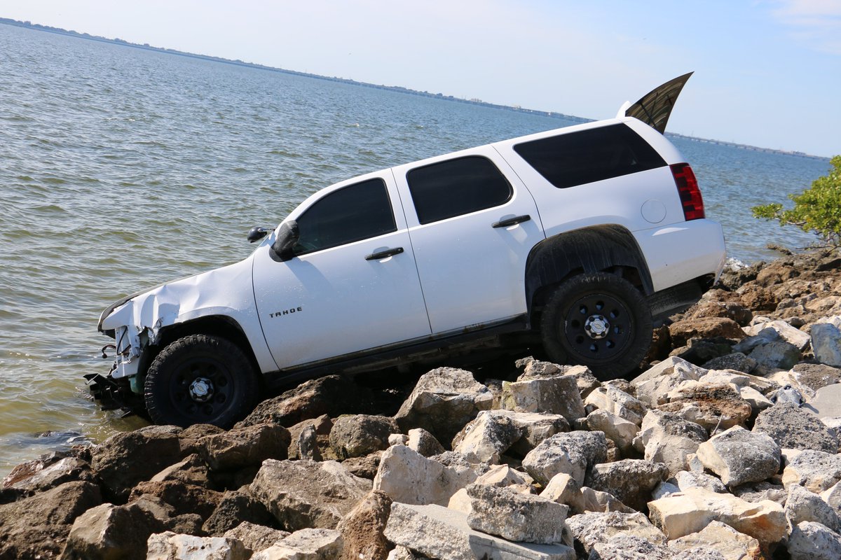 The driver of this Tahoe was cited for careless driving after veering off the Courtney Campbell Causeway and ending up in a precarious perch on the rocks and partially in the waters of Old Tampa Bay