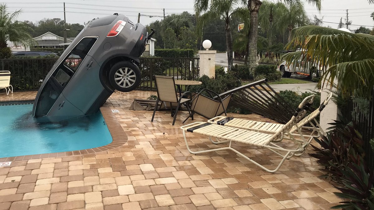 A woman was cited with careless driving after crashing her car into a community swimming pool in New Port Richey this morning