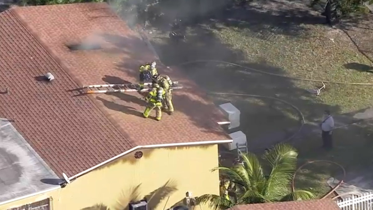 A child was among three people hospitalized after a fire broke out at a home in northwest Miami-Dade Monday.