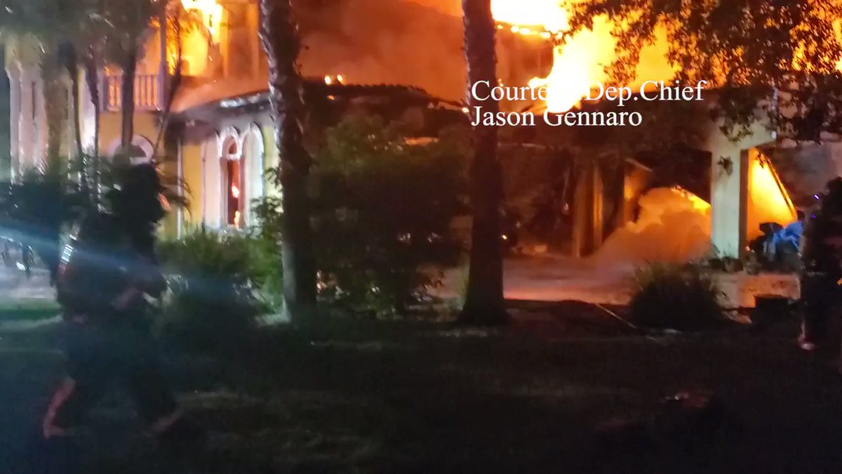 Fire Crews on scene of 10,000 sqft structure shooting flames from the roof area. Dep. Chief stated their crews went defensive to the home in the area of Woodlands East Lake Community. 