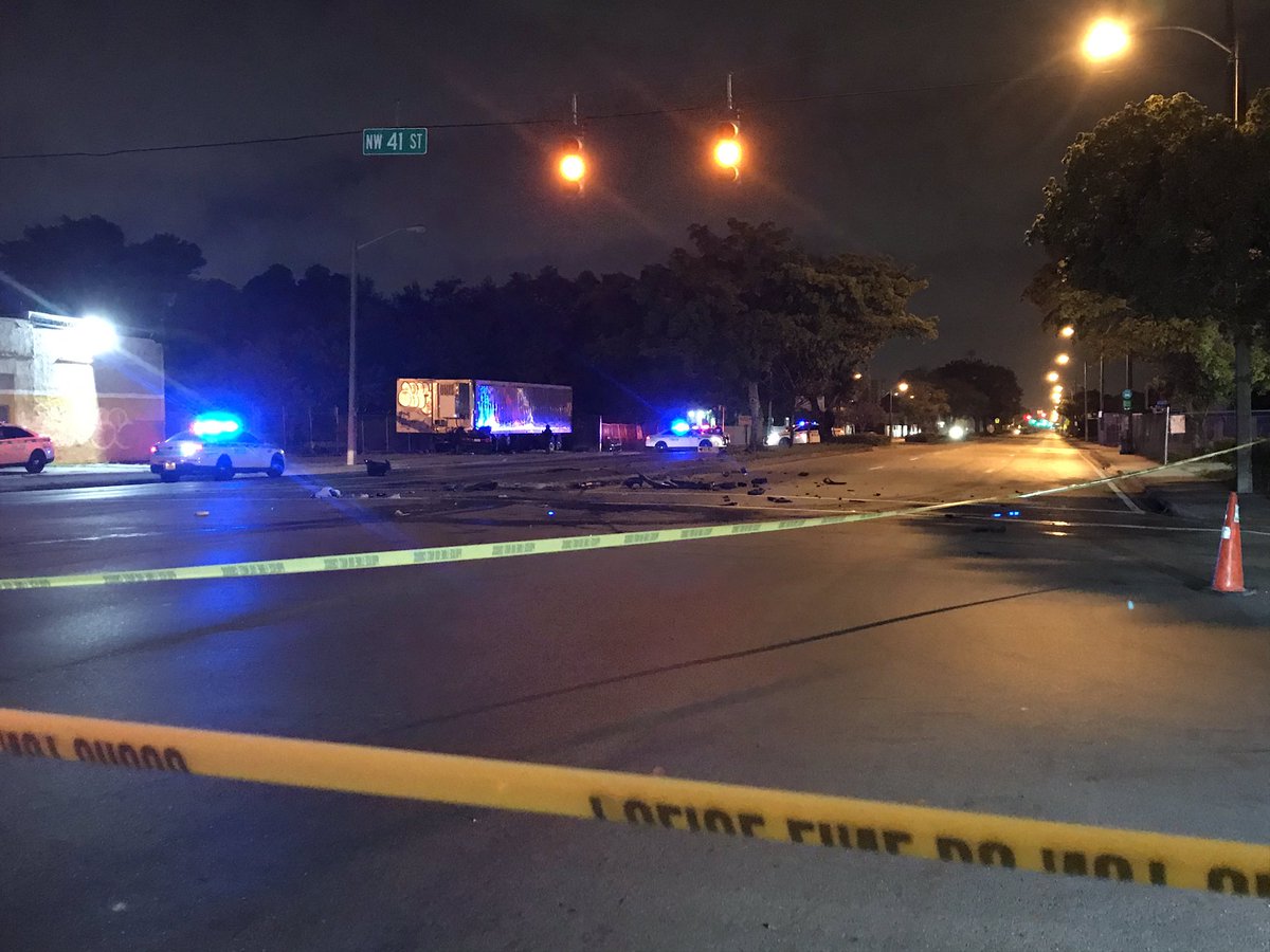 Serious crash in NWDade. Car is pinned under trailer, the driver had to be extricated. It may be connected to a separate scene where investigators located another badly damaged vehicle, person in custody nearby 