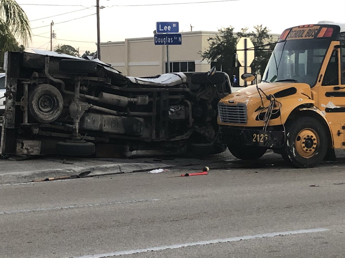Confirmed from the scene in Lee Blvd near Douglas Ave. Bus 2126 headed to Riverdale. 2 students said their backs hurt - bus vs truck - driver of truck injured  - two lanes are blocked - expect delays - tow truck here
