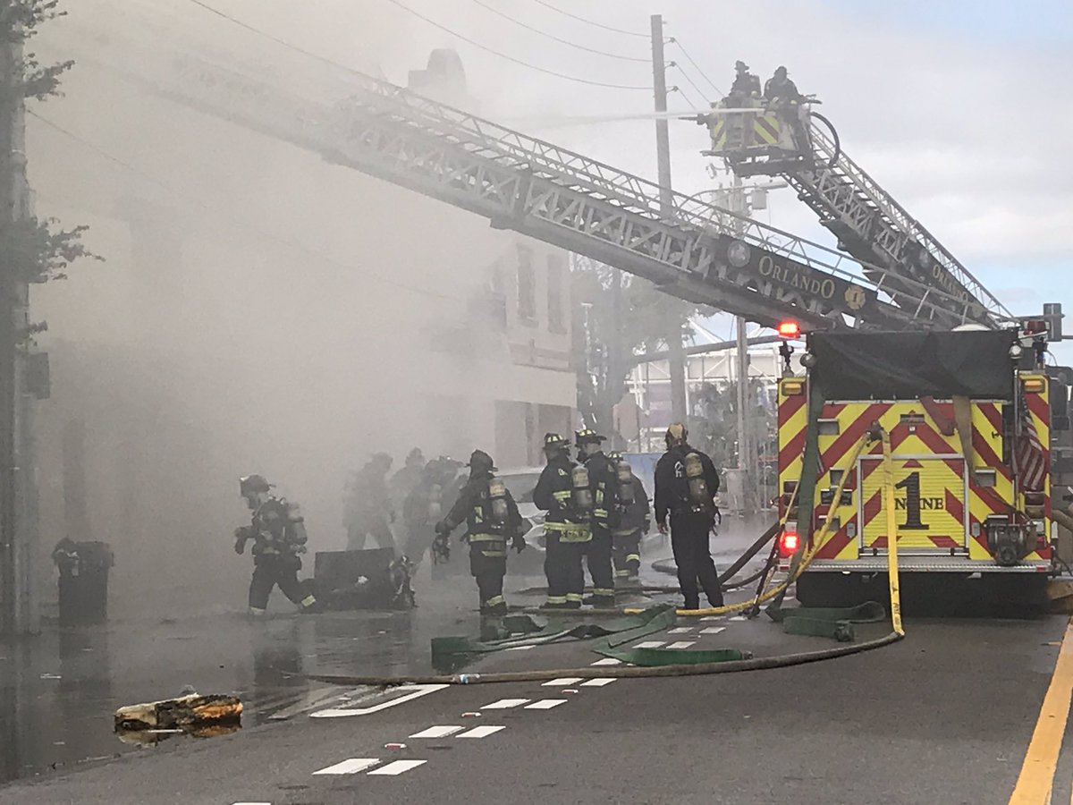 Smoke still heavy and street starting to flood as firefighters battle blaze in Orlando. This is West Central Boulevard just a few blocks away from the @OrlandoCitySC stadium. 