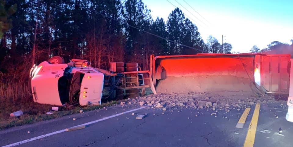 A photo of the truck that flipped on Lem Turner Road from an  Looks like the truck was hauling gravel/dirt