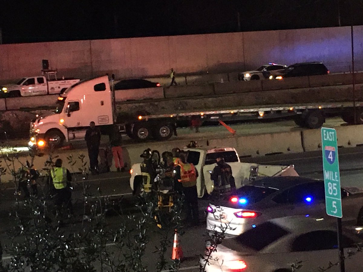 OrlandoFireDept firefighters work to rescue passenger in pickup on I4 East at Princeton 