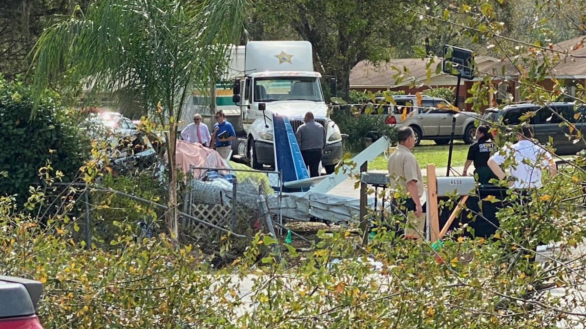 Photo shows scene where small plane crashed in roadway of Bartow neighborhood; two people died, Polk County Sheriff's Office says