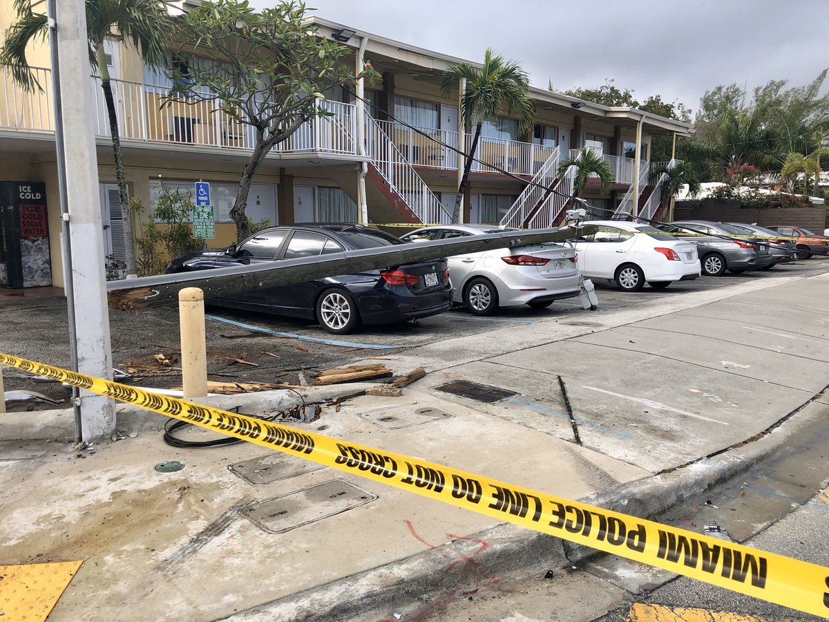 Noticed this scene while driving down Biscayne Blvd. . A light pole fell onto cars parked at the Sinbad Motel. Strong winds last night