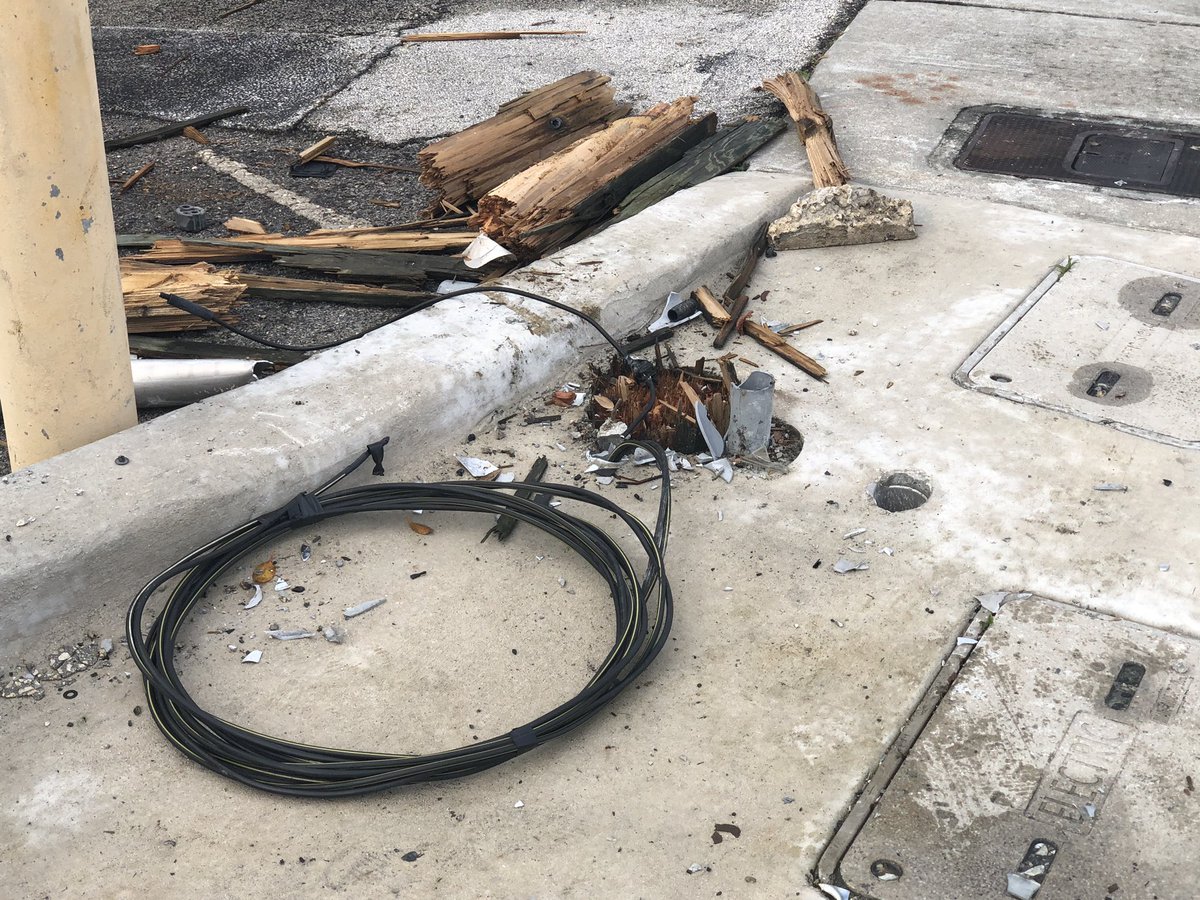 Noticed this scene while driving down Biscayne Blvd. . A light pole fell onto cars parked at the Sinbad Motel. Strong winds last night