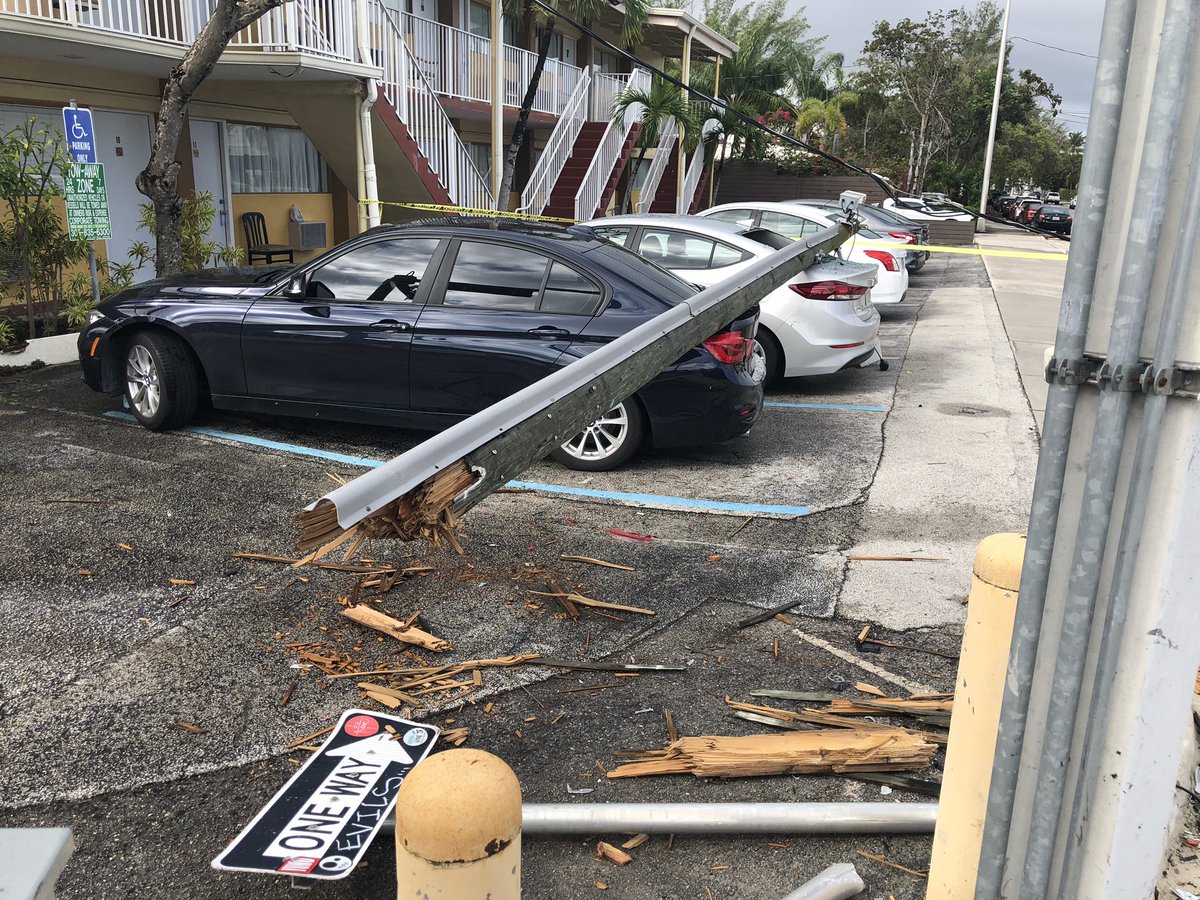 Noticed this scene while driving down Biscayne Blvd. . A light pole fell onto cars parked at the Sinbad Motel. Strong winds last night