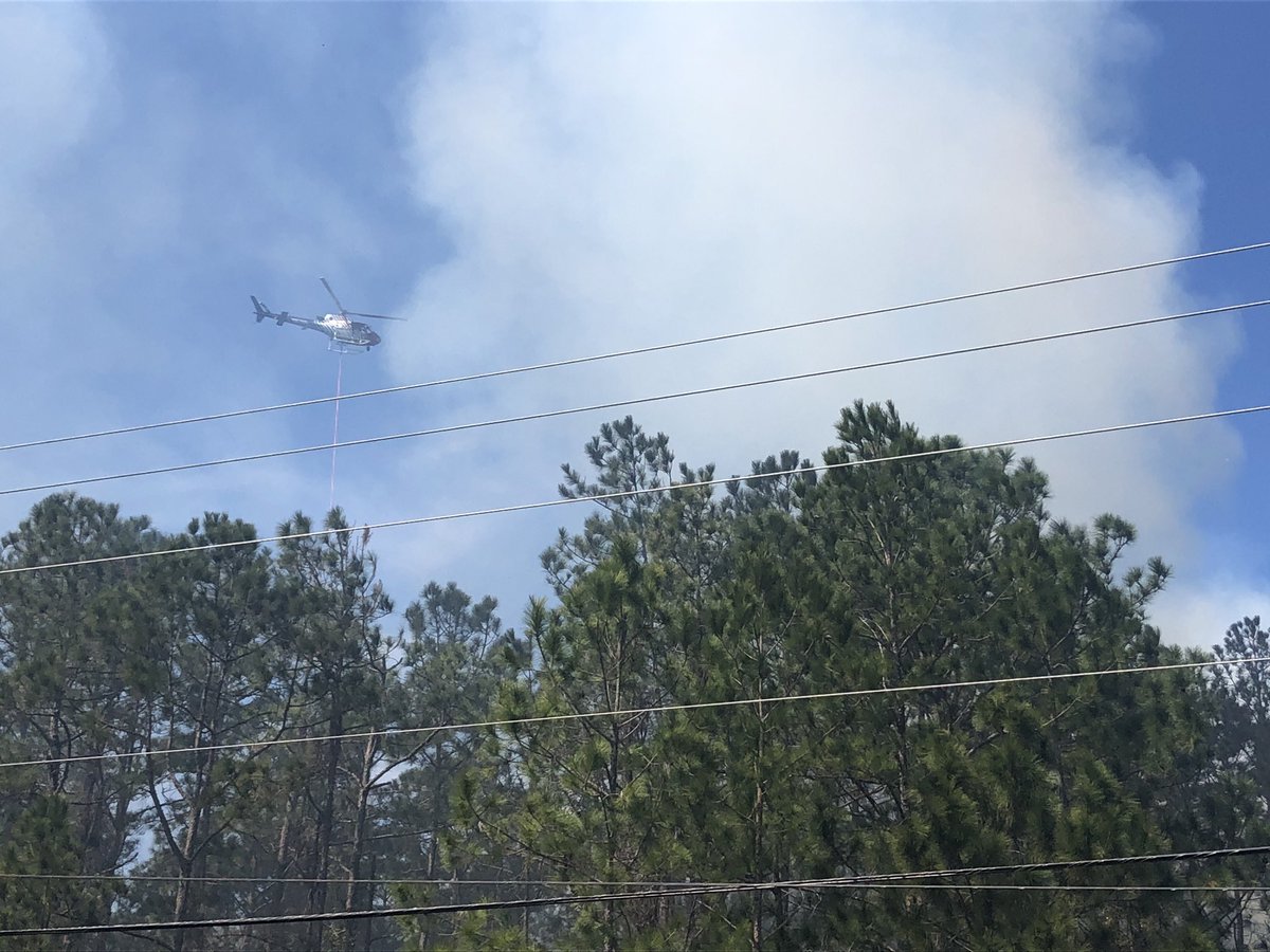 2:03 pm Current acreage estimates have the fire around 8 acres.  The division of forestry has 3 plows on site and has a containment line around the fire.  Wind and smoke continue to be an issue but there are no structures currently in danger