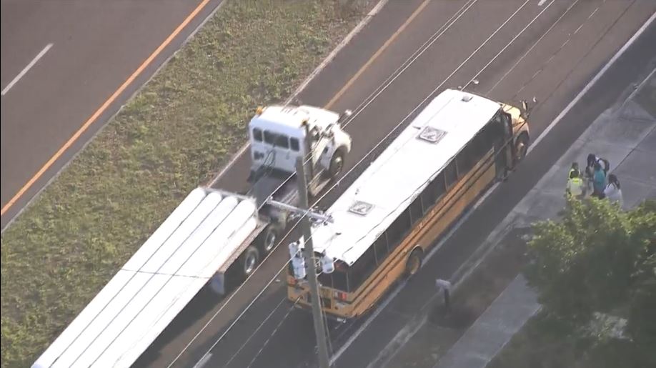 No injuries after semi-truck sideswipes school bus in Polk County