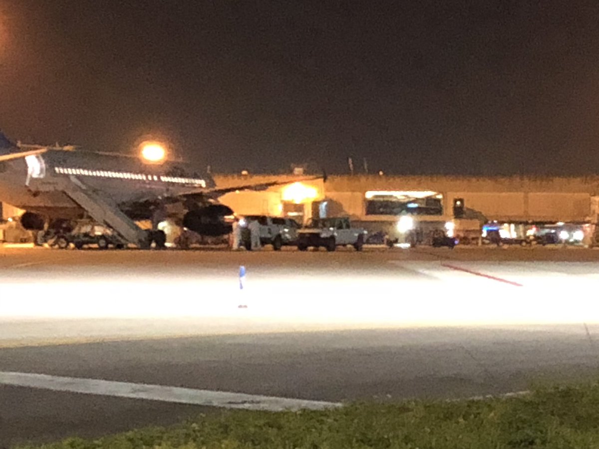 Crews in hazmat suits seen getting on and off JetBlue plane at PBIA where passenger tested positive for coronavirus 