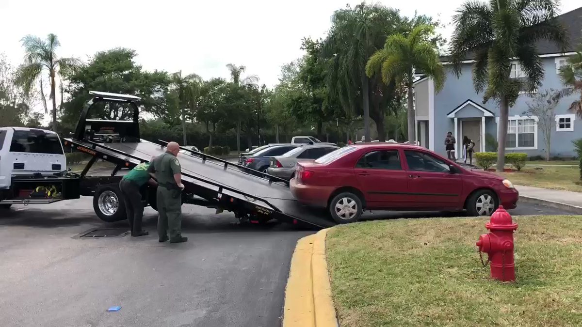 IRCSheriff deputies are towing a small red car at the scene of a shooting at Pemberly Palms apartments. No injuries were reported.