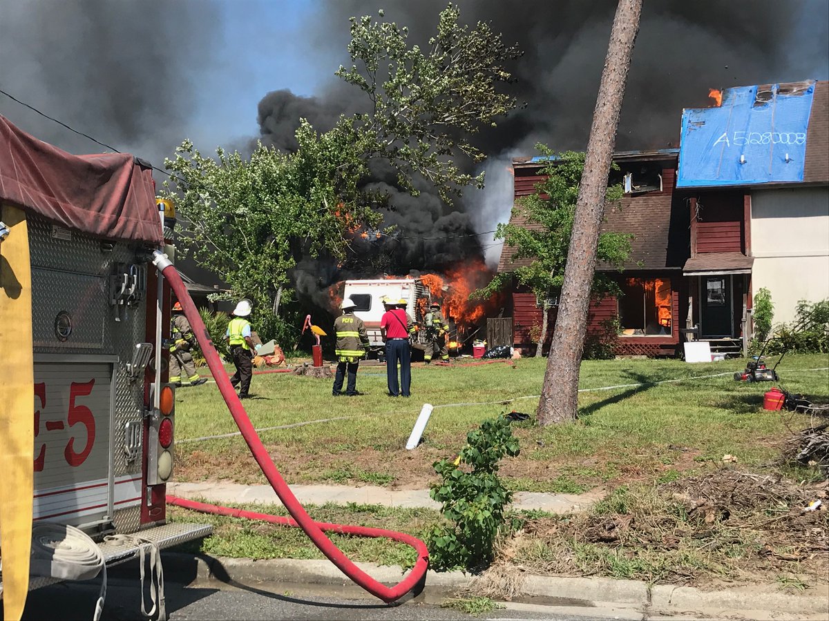 Firefighters are at the scene of a fire on Token Road in Panama City. 