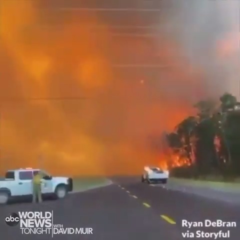 New video from Walton County, Florida, shows flames burning on both sides of a highway as wildfires on the Florida Panhandle burn thousand of acres and force hundreds of residents from their homes