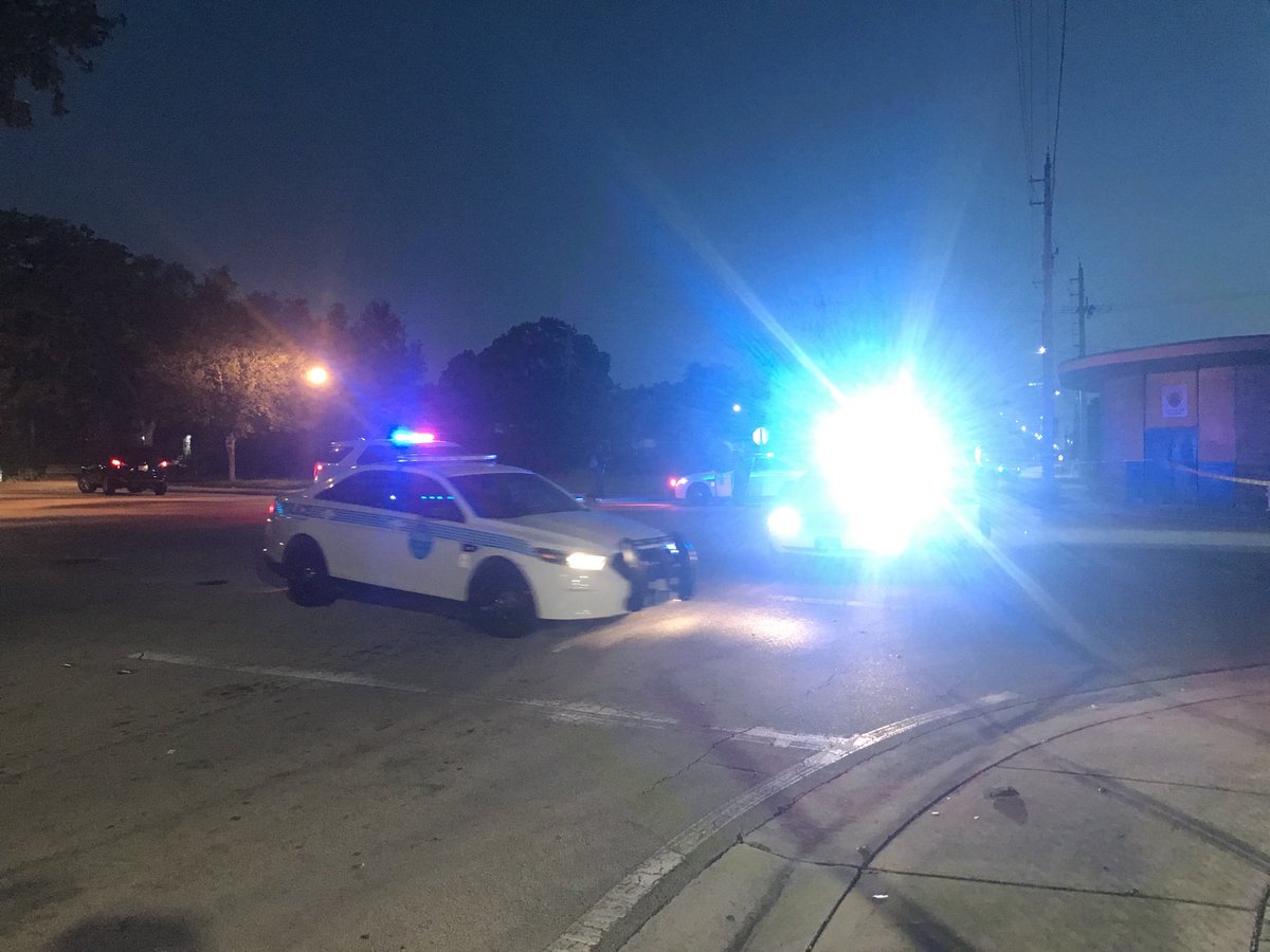 Police guarding scene of bullet casings on ground after reports of someone shooting out of a Range Rover in Liberty City