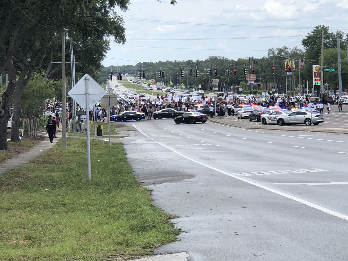 Massive protest has shut down the intersection of Fowler Ave and N 56th in Temple Terrace. Protestors chanting GeorgeFloyd's name & We Can't Breath. Mix of @HCSOSheriff deputies, local police & Florida Highway Patrol officers at scene. @WFLA