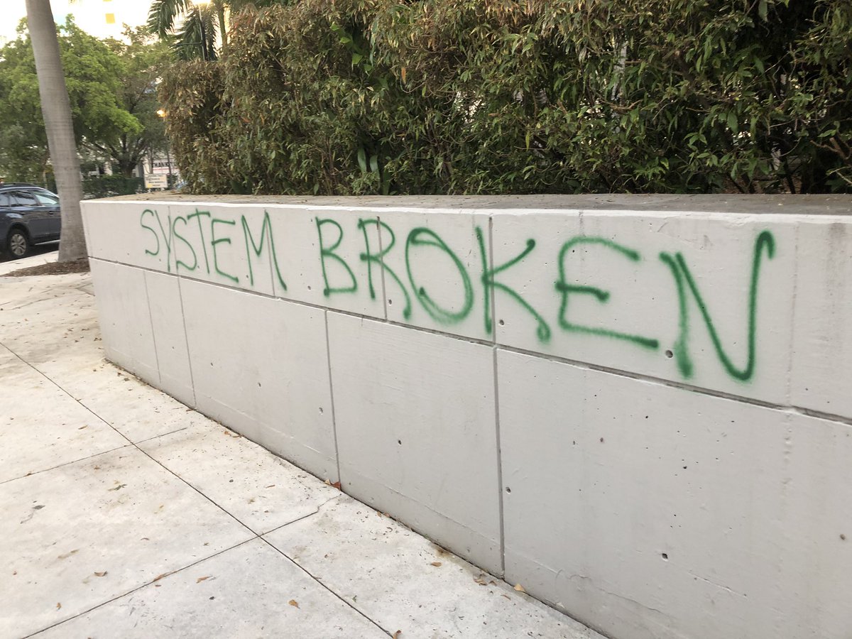 Smashed window at Miami Dade College's downtown campus and ransacked vending machines, but most of campus looks untouched, beyond graffiti