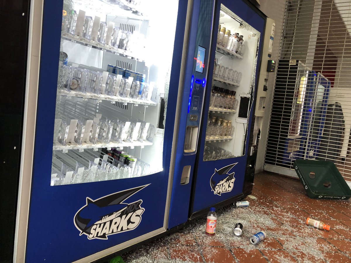 Smashed window at Miami Dade College's downtown campus and ransacked vending machines, but most of campus looks untouched, beyond graffiti