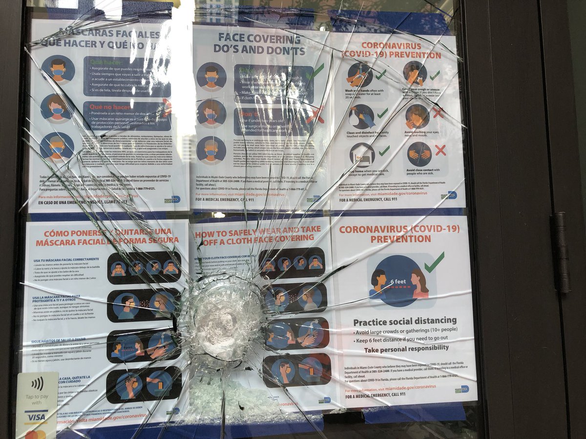 Smashed windows at jewelry stores and offices on Miami's NE 1st Avenue, as Miami's coronavirus emergency overlaps with a night of unrest