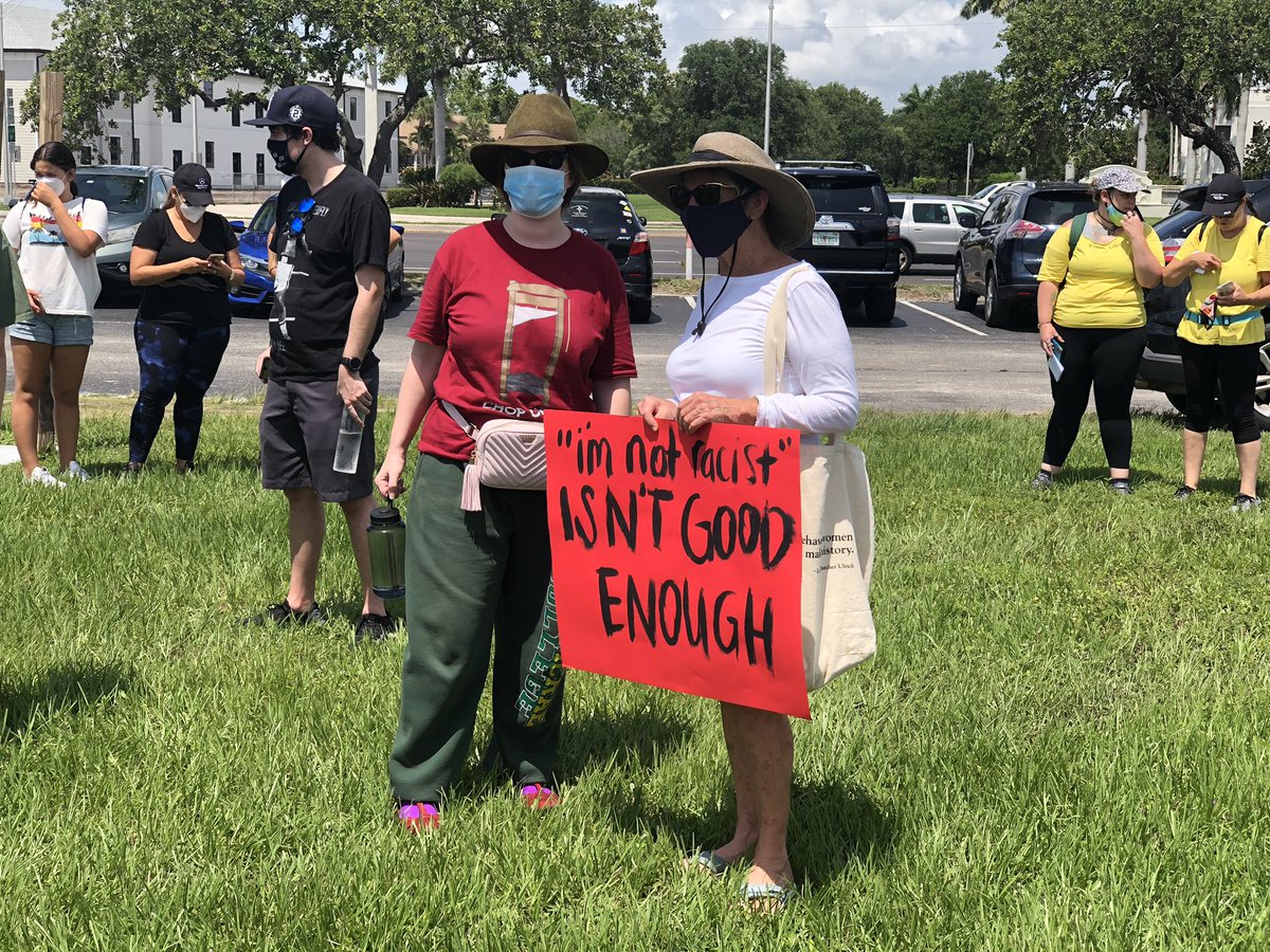 Protesters gather near the base of the Roosevelt Bridge in Stuart. Walk will begin at noon