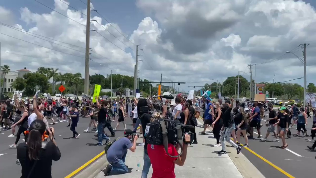 Thousands of protestors marching up the Roosevelt Bridge in Stuart, FL in honor of George Floyd chanting No justice, no peace and Black Lives Matter