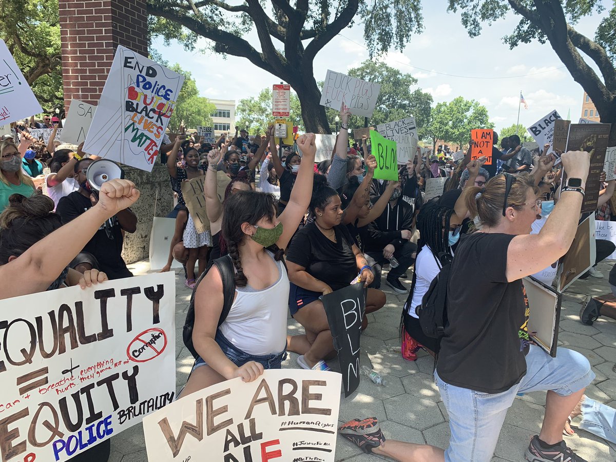 Peaceful protestors take a knee against police brutality in Lakeland's Munn Park. Crowds have grown; they remain peaceful