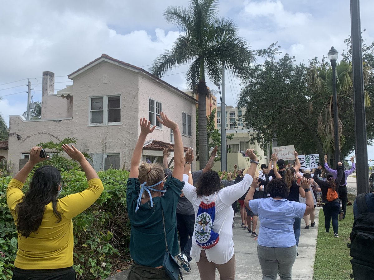 Marches head south to Okeechobee Blvd chanting, Hands up, don't shoot