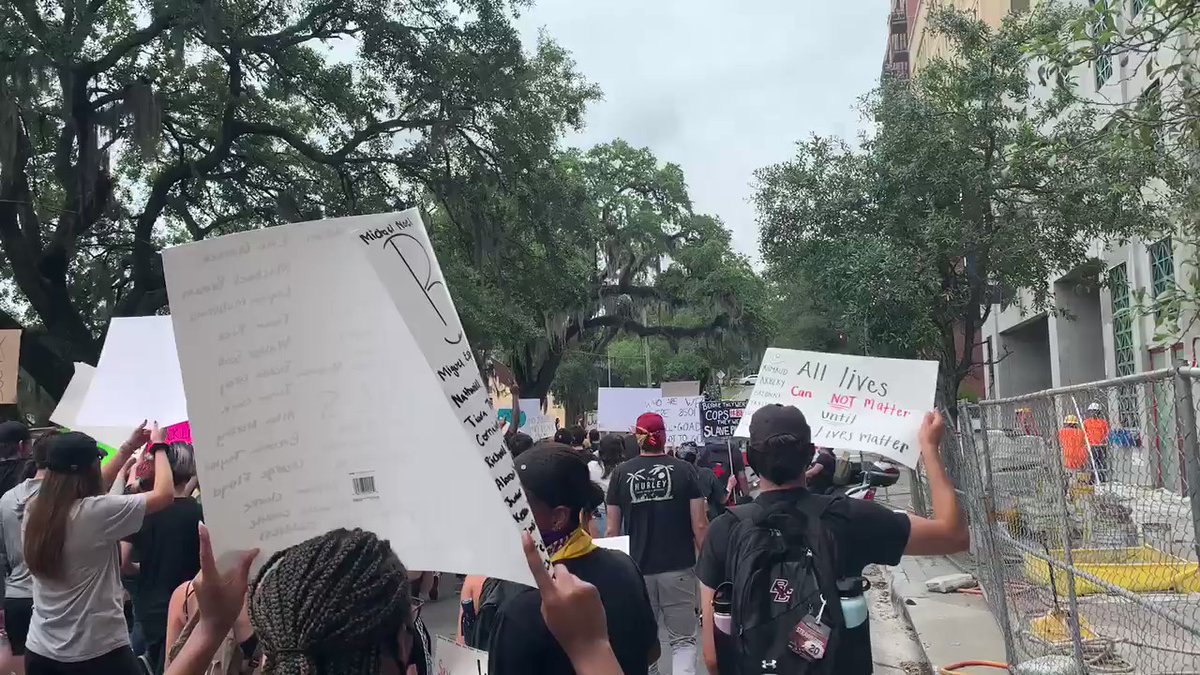 Caravan protest   heading down Bronough, turning on Monroe: hundreds of people marching