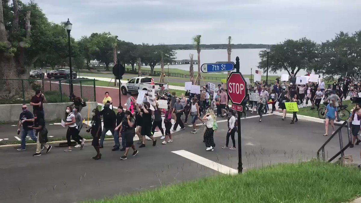 Protestors coming up 7th street   chanting no justice, no peace. 