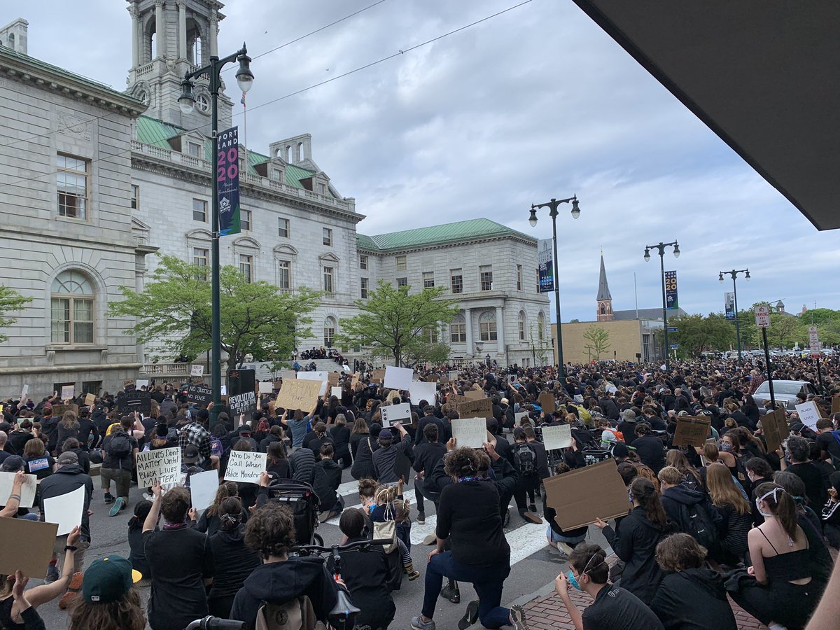 Powerful moment as hundreds kneel in the street 