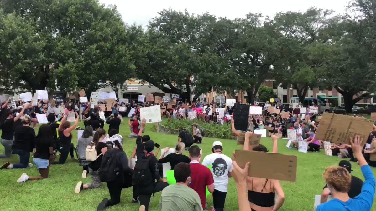Black Lives Matter Vero Beach marchers are taking an extended moment of silence at Pocahontas Park.