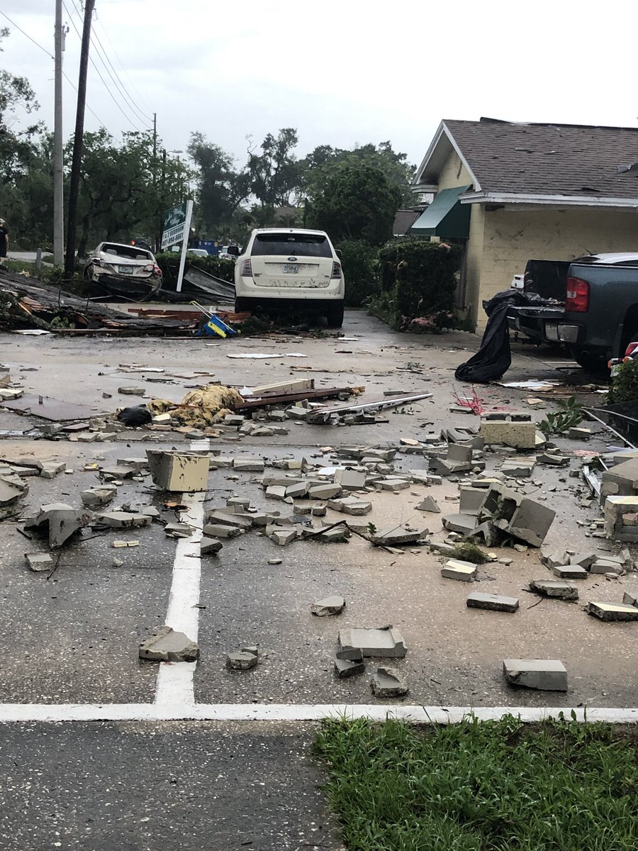One woman tells her neighbor's car was parked in this empty space, the tornado pushing it 20, 30 feet down and taking the roof of the apartment next to it with it 