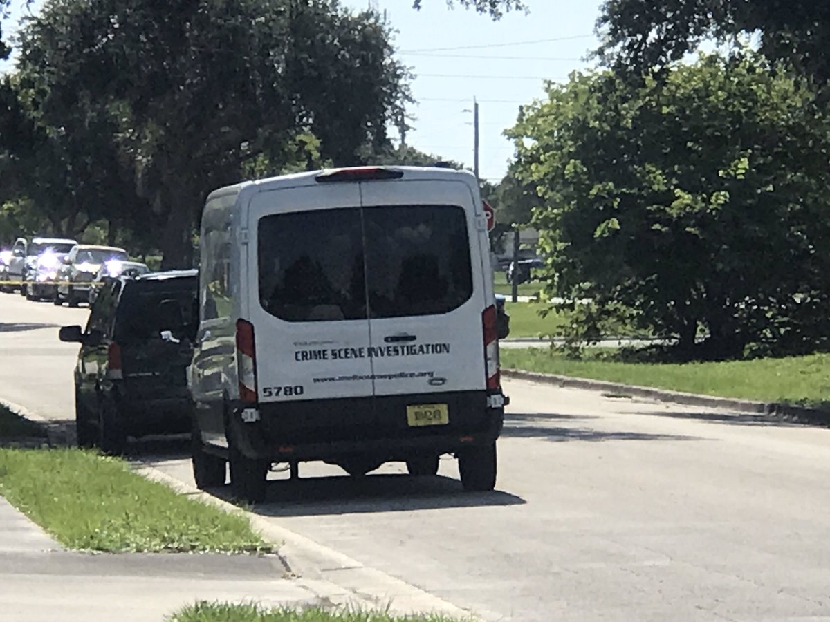 Detectives and CSI searching along University for shell casings. 