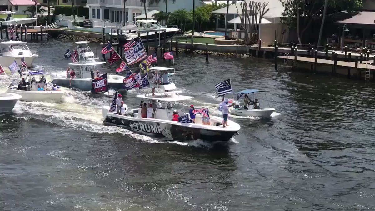 Demonstration's organizer has boat wrapped with a @realDonaldTrump theme.  The boat parade is going under the PGA Blvd bridge. 
