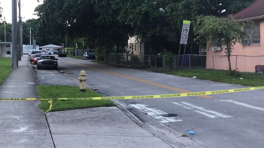 Miami Police Homicide Detectives investigating a double shooting.  NE 59th St & 1st Ave. 1 man died on the scene. Another is at the hospital. 