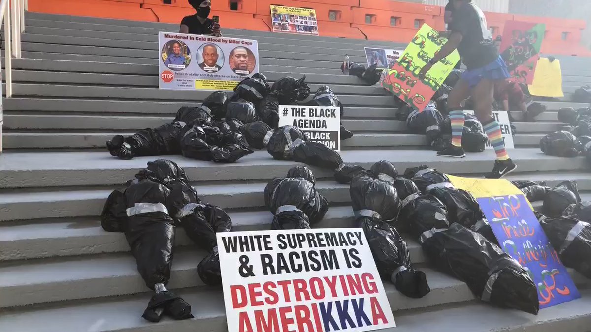 Protesters put fake body bags outside of @JSOPIO to make a statement against racial injustice & police brutality. They're holding signs saying protect and serve not kill. These protesters say they need more done by @lennycurry than just taking down Confederate statues. 