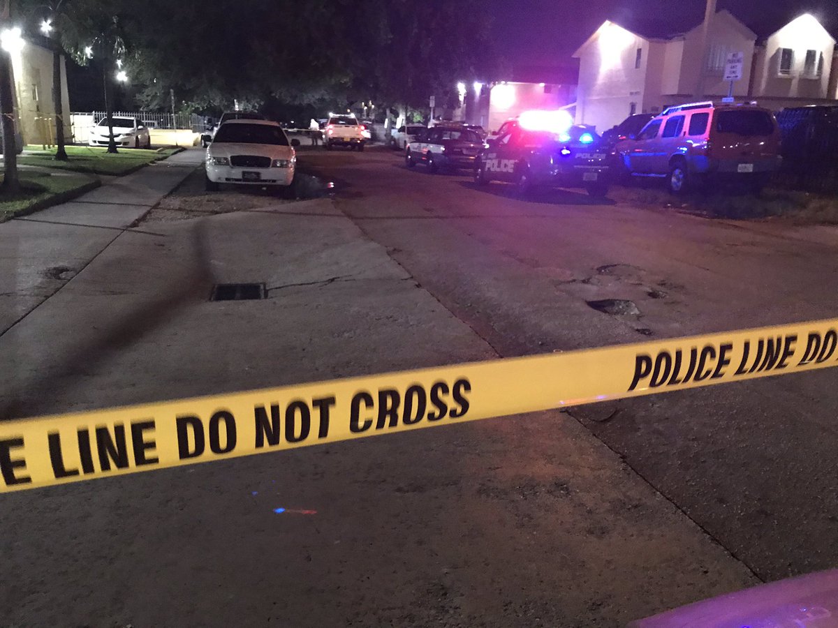 Early morning police investigation on West 25th Ct near 60th Street in Hialeah. This is outside several apartments and near a shopping center. police taking pictures of a car with at least one bullet hole in passenger side window.